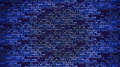 蓝色的背景。笔记本电脑屏幕上的编程语言。网站的程序代码PHP HTML JavaScript。笔记本