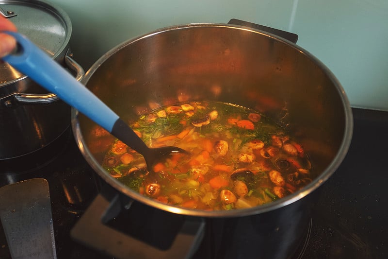 Vegetable soup in a pot in domestic kitchen - prep