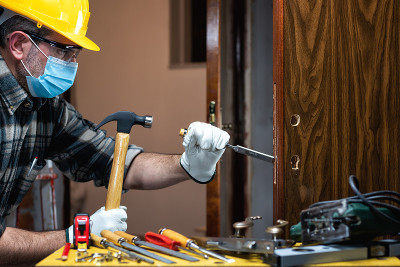 Carpenter at work protects the face with the surgi