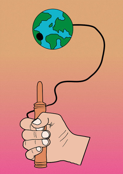 用手和地球玩杯球游戏。保护地球