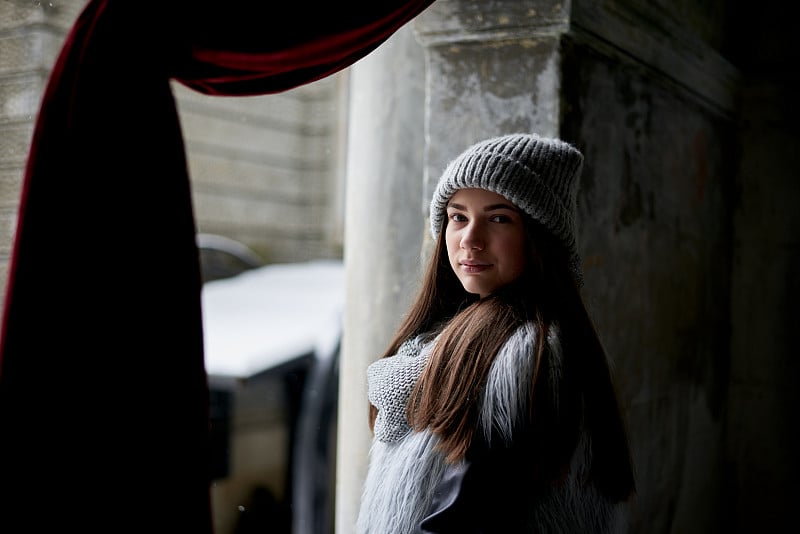 Young woman on city walk in winter