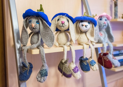 many hand made knitted sad hares. amigurumi rabbit