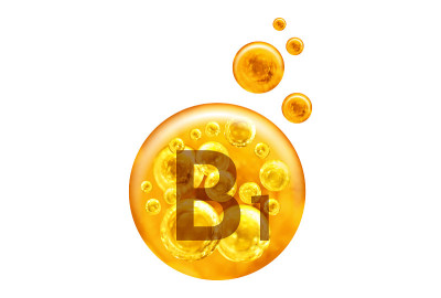 维生素B1胶囊。白色背景上带有孤立气泡的金色小球。健康的生活方式的概念。
