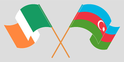 Crossed and waving flags of Azerbaijan and Ireland