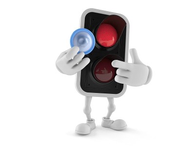 Red traffic light character holding condom