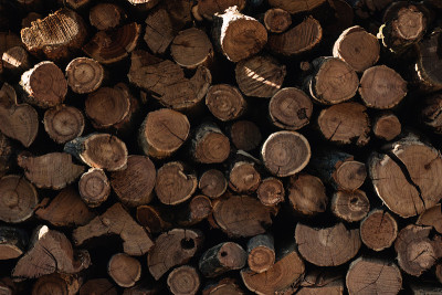 the wooden beams are stacked on top of each other.