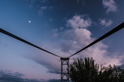 Zhytomyr bridge at sunset against a pink and purpl