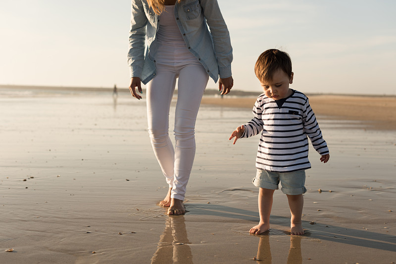 Mother at the beach with toddler