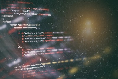 CSS, JavaScript和HTML的使用。监控功能源代码的特写。摘要IT技术背景。软件源代码。