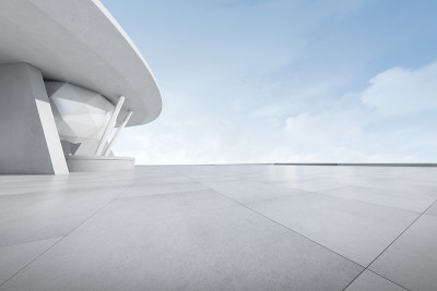 3d渲染的未来主义建筑与空混凝土停车场。