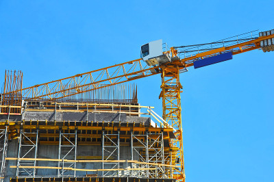 Crane and highrise construction site