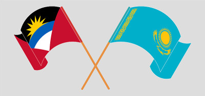 Crossed and waving flags of Antigua and Barbuda an