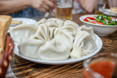 Top view of traditional Georgian lunch: khinkali, 
