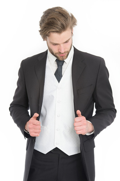 穿着正式服装的男子被隔离在白色上。