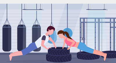 sports couple doing push-up exercise on tires man 