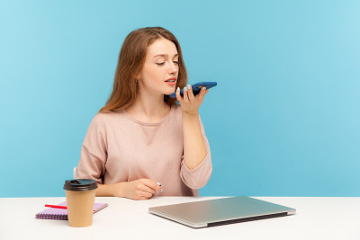 Digital speaker app. Young woman employee sitting 