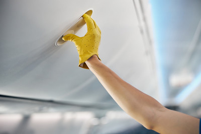 Beautiful female arm open the luggage compartment