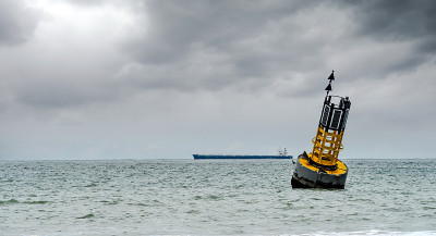 cardinal buoy stranded on the beach