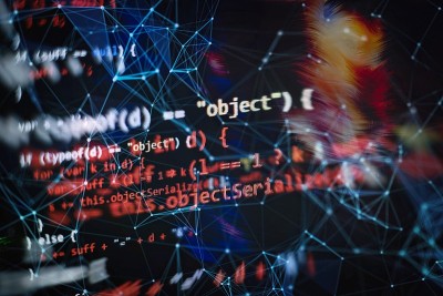 笔记本特写照片。CSS, JavaScript和HTML的使用。监控功能源代码的特写。摘要IT技术背