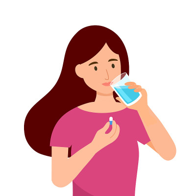 妇女吃药治病。女性服用维生素或加水胶囊。