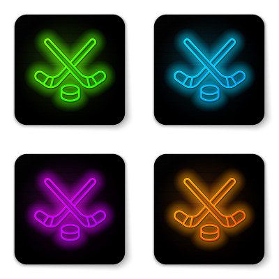 Glowing neon line Ice hockey sticks and puck icon 