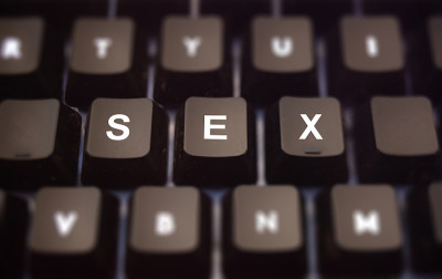 Sex online concept. Sex text written on keypad. Bl