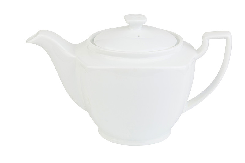 白色背景的茶壶里的绿茶
