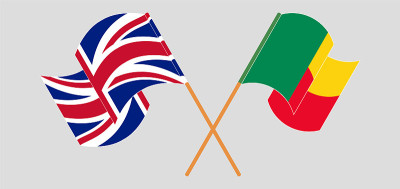 Crossed and waving flags of Benin and the UK