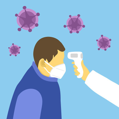 Measuring the temperature of a man in medical mask