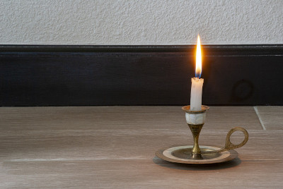 Candle light in empty space inside the house in Gu