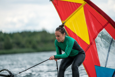 Woman learning how to windsurf