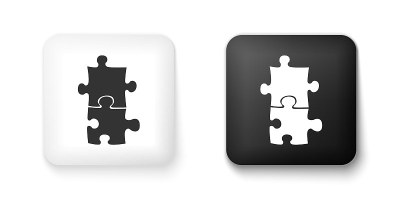 Black and white Piece of puzzle icon isolated on w