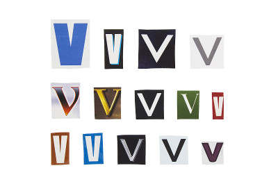 从杂志纸上剪下字母V。带有字母V的剪报被隔离在白色背景上。匿名文本的概念。