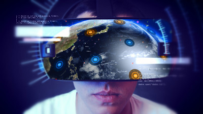 帅气的年轻人戴着VR头戴体验虚拟现实。