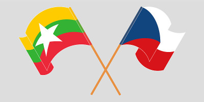 Crossed and waving flags of Myanmar and Czech Repu