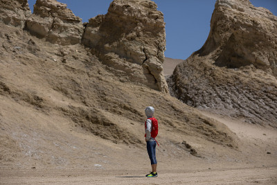 Woman trail runner on sand desert dunes