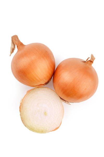 white onion in yellow scales and cut, isolate on a