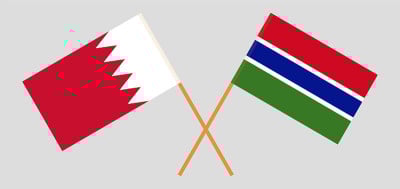 Crossed flags of Bahrain and the Gambia