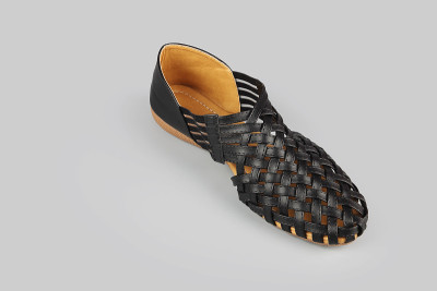 Girl's stylish leather shoes on gray background