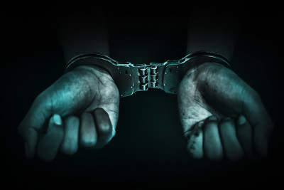 商人手戴手铐，犯罪概念逮捕