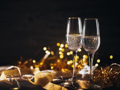 Two Christmas glasses of champagne on the table co