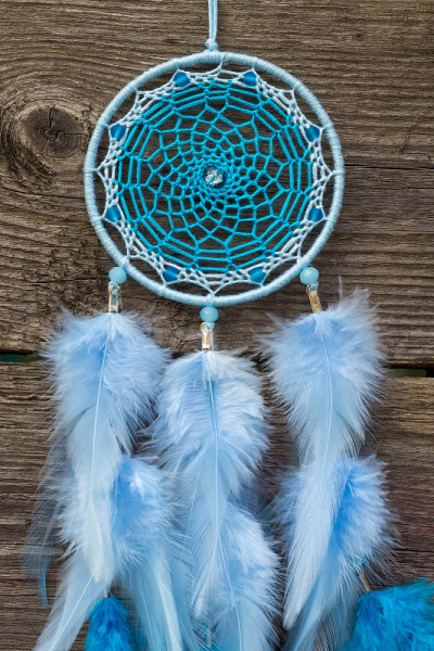 Handmade dream catcher with feathers threads and b