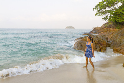 Woman playing wave in morning on Lonely Beach at b