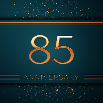 现实的85周年庆典设计横幅。金色数字和五彩纸屑在绿色背景。彩色矢量模板元素为您的生日派对