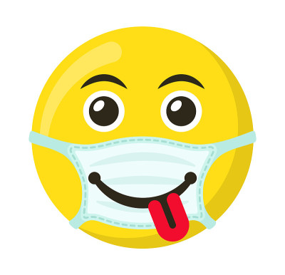 黄色表情和医用面具上的微笑表情