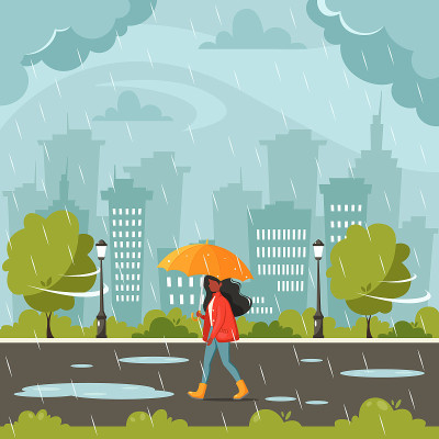 一位在雨中撑伞的黑人妇女。秋天下雨。秋季户外活动。