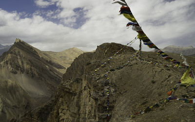 Spiti valley flanked by Himalayas under blue sky a