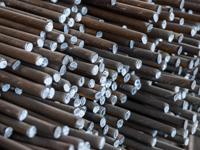 Lots of old metal bars stacked on top of each othe