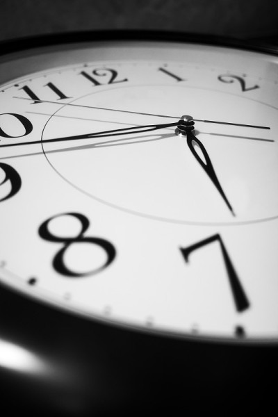 Close up of a wall clock on dark background