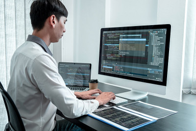 Developer programmer working on coding program sof